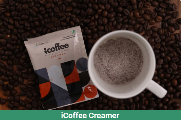 iCoffee Creamer sachet with cup on coffee beans